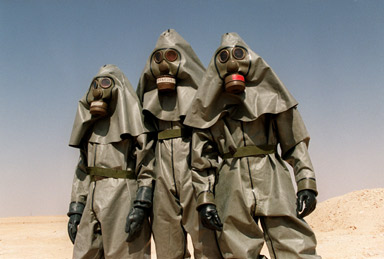 Soldiers in chemical protective suits. Hot and ugly